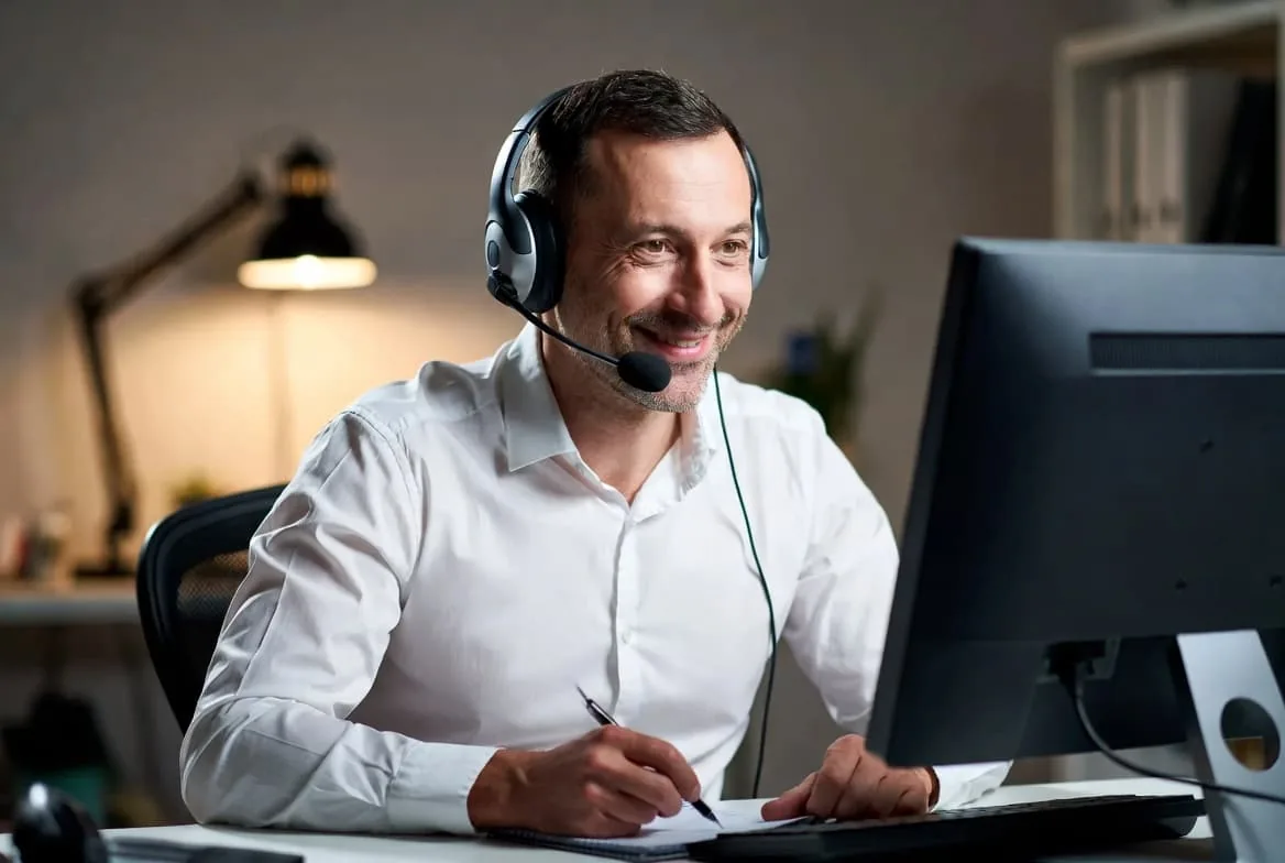 Friendly NoBull IT Solutions technician providing remote phone support to a client in Cambria County